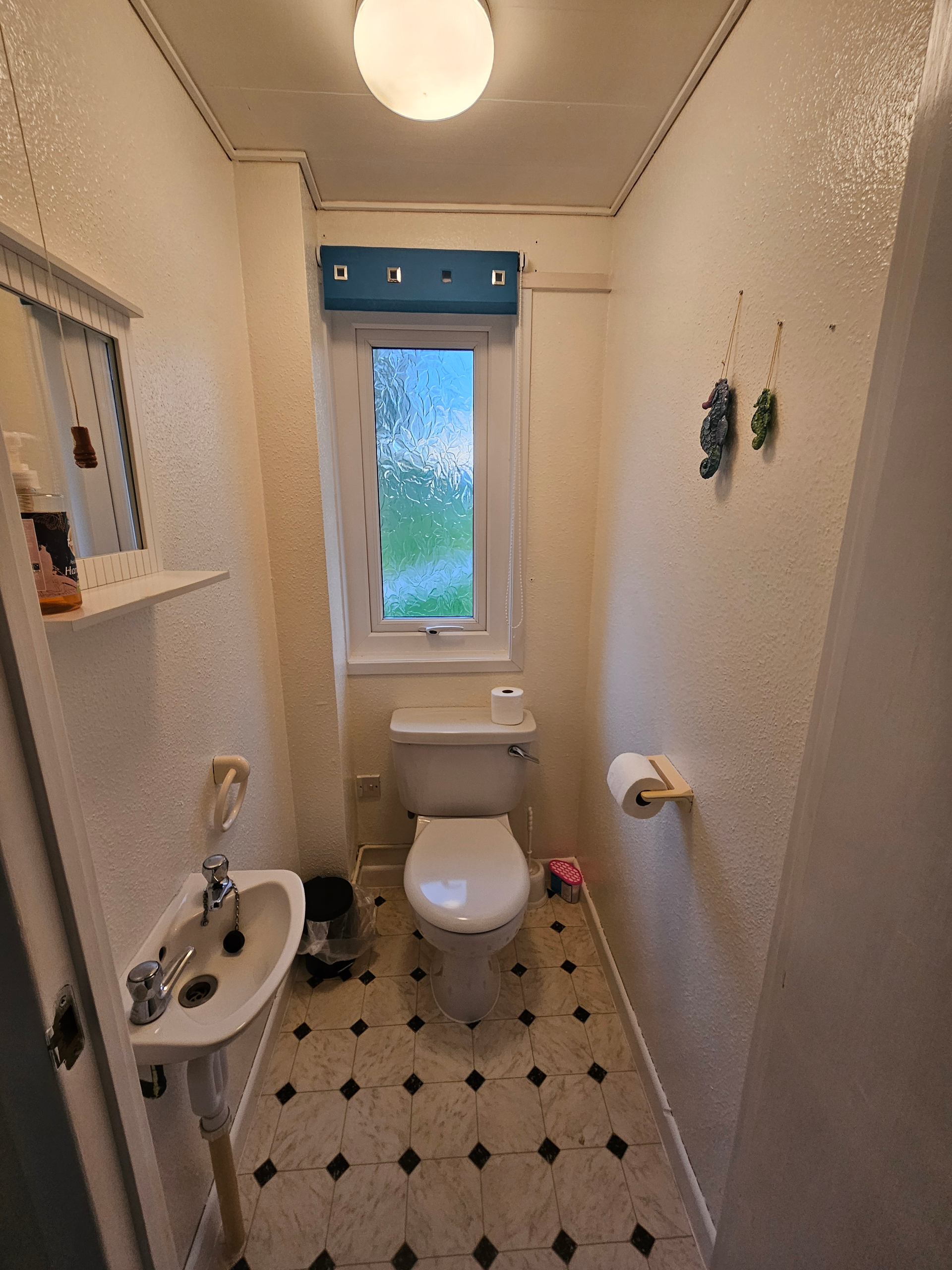 The WC, which has a toilet and a sink